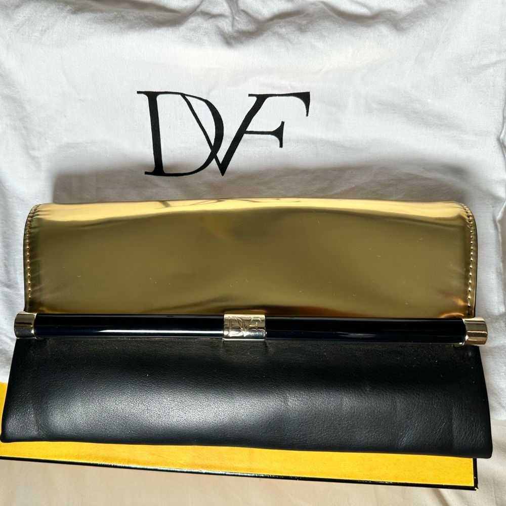 Diane Van Furstenberg Black and Gold Envelope Clutch with magnetic closure